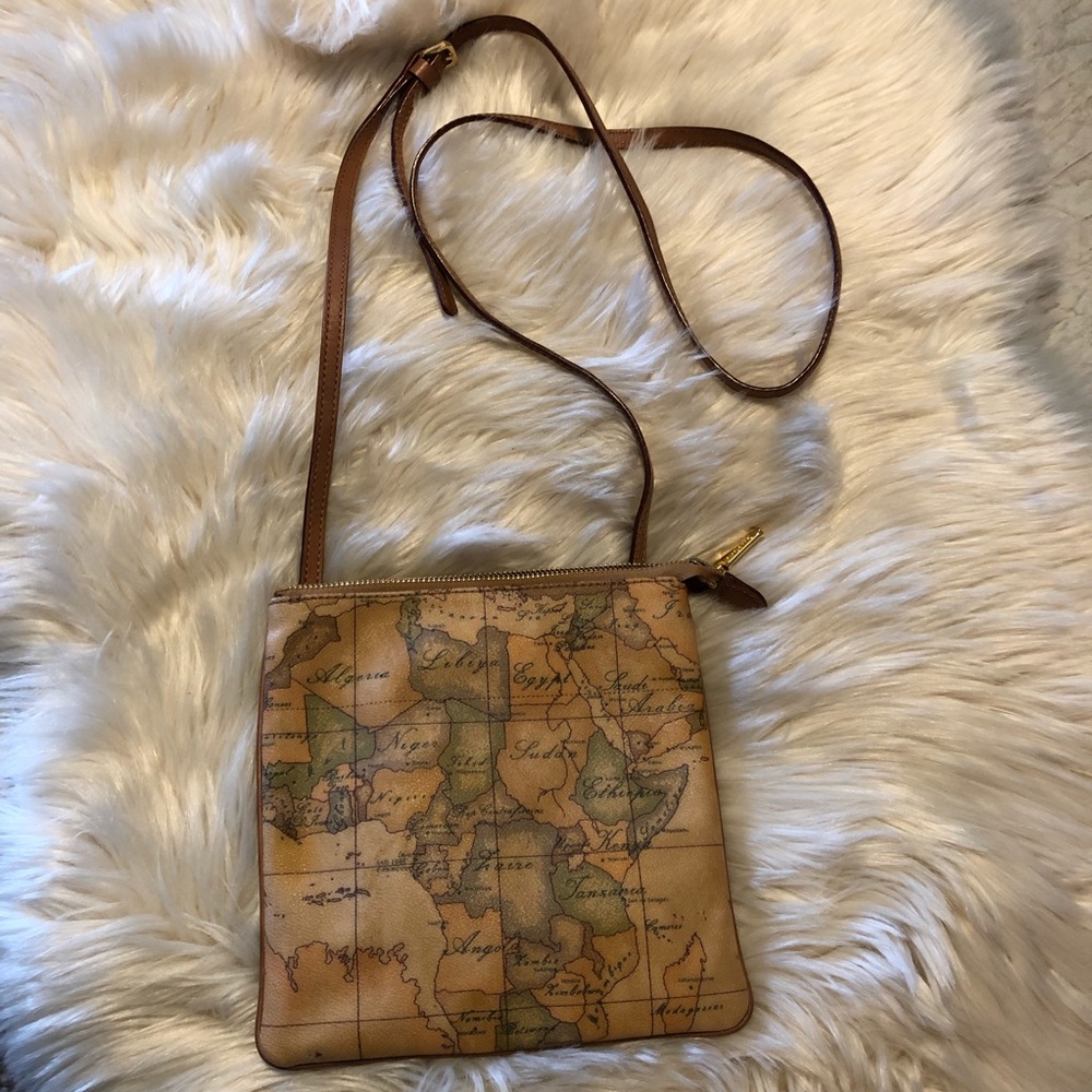 Tilasse Alviro Martin coated canvas map print crossbody with leather strap.